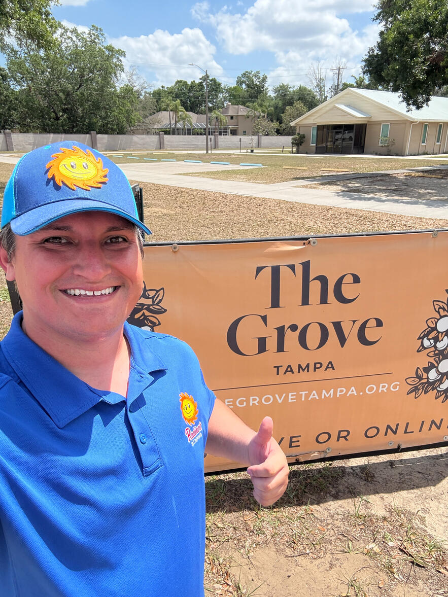 The Grove Tampa in Brandon Florida parking lot striping by Radiant Striping of Tampa Florida. Radiant Striping logo selfie picture.